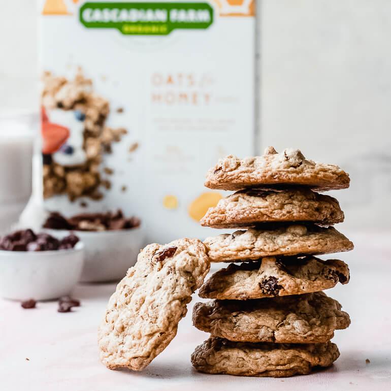 Image of a stack of Cascadian Farm maple pecan cookies with Cascadian Farm cereal box in the background